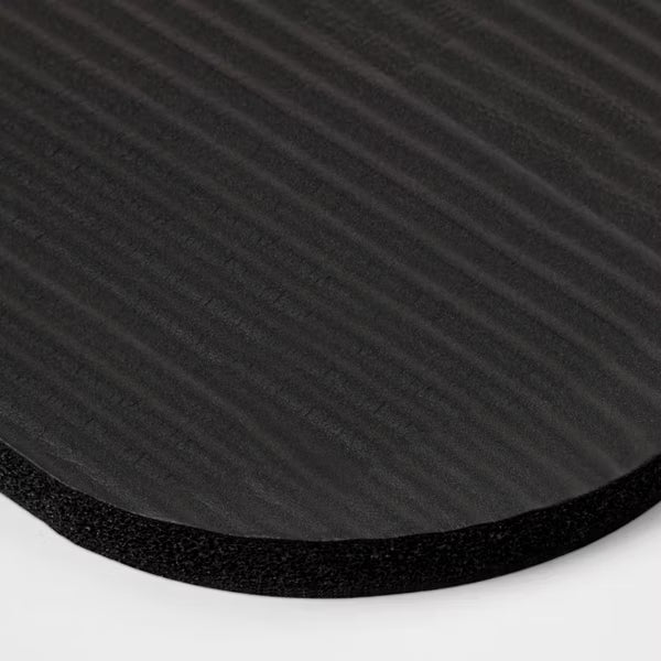 Premium 15mm black fitness yoga mat with non-slip texture and carrying strap