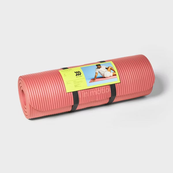 Premium 15mm orange fitness yoga mat with non-slip texture and carrying strap