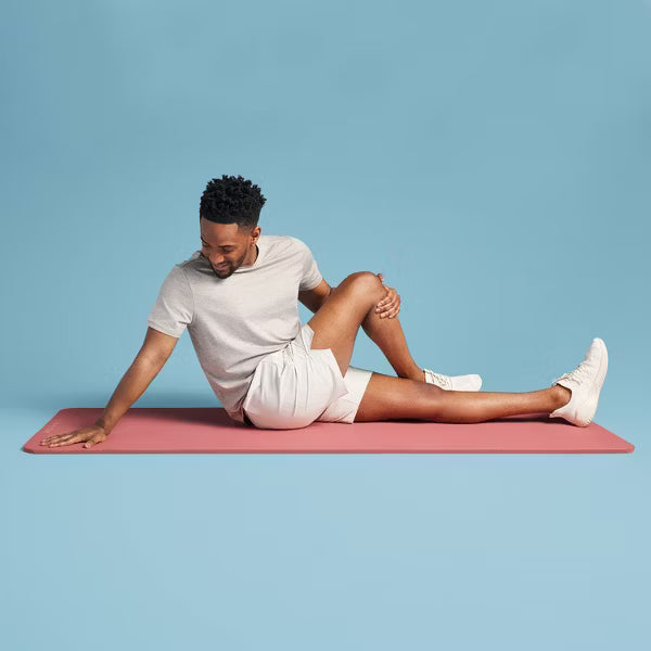 Premium 15mm orange fitness yoga mat with non-slip texture and carrying strap